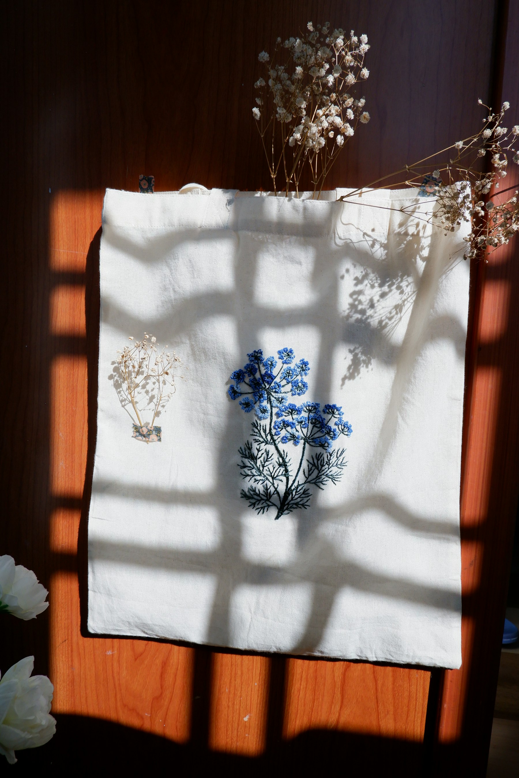Illustrative editorial view of a personalized fabric tote for the Accessory Decorating Station