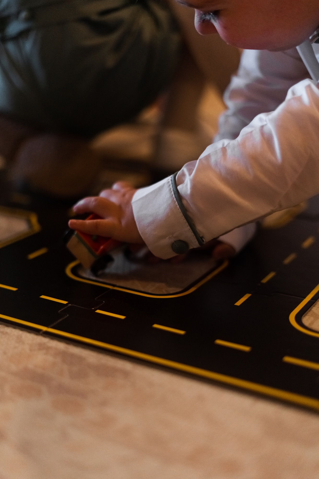 Toddler play area with road mat and cars for young children