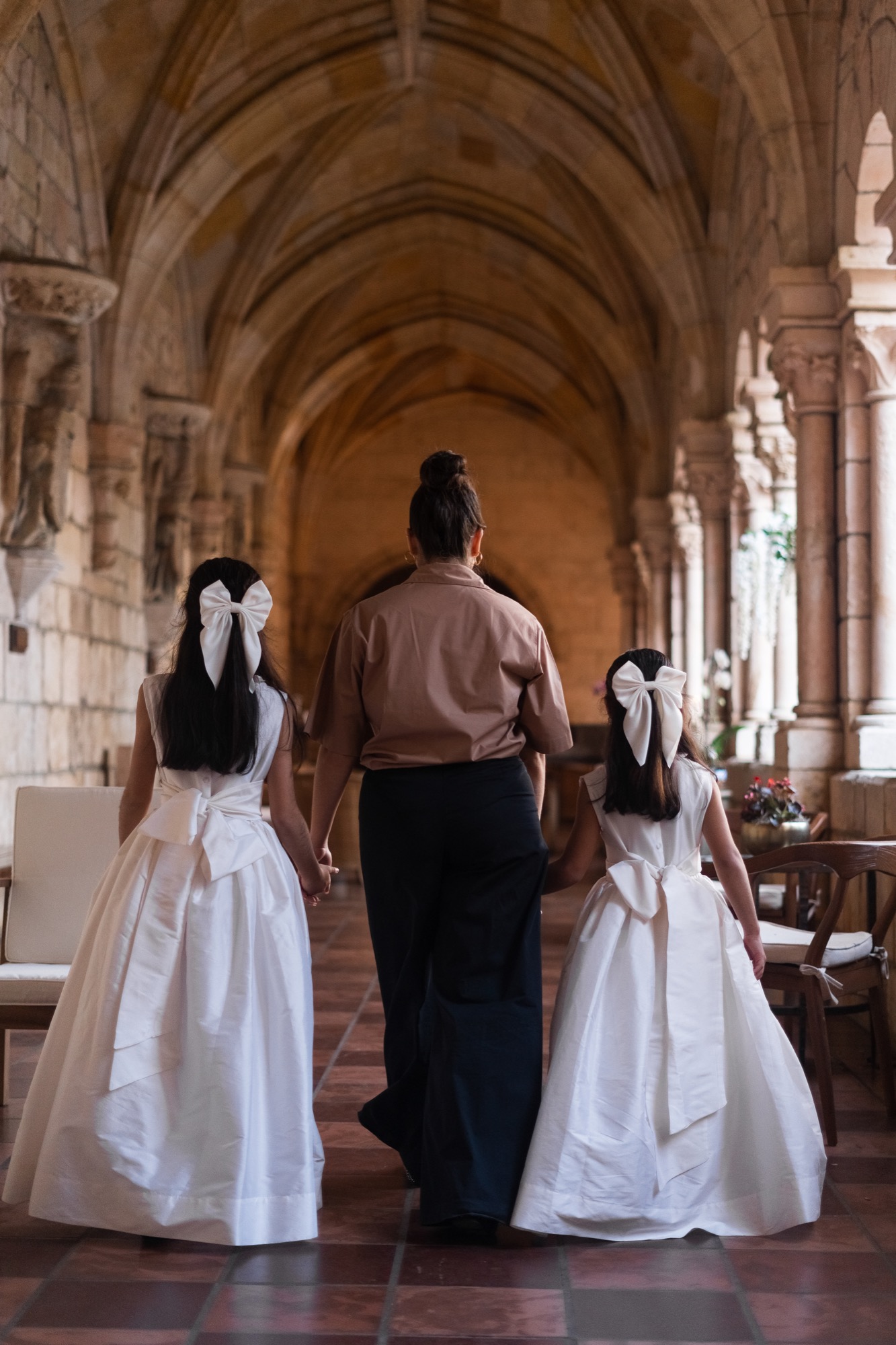 Professional wedding nanny caring for child during ceremony